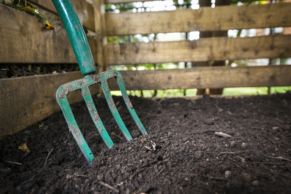 Garden fork turning top soil